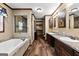 Spacious bathroom with double sinks, a walk-in shower, and a soaking tub at 80 David Rd, Hampton, GA 30228