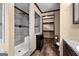 Tiled shower and walk-in closet area, as seen in this well-designed bathroom space at 80 David Rd, Hampton, GA 30228