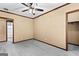 Bedroom with grey carpet, a ceiling fan, and an open closet at 80 David Rd, Hampton, GA 30228