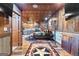 Unique bedroom featuring a metal ceiling, hardwood floors, a bed and a partial view of the kitchen at 80 David Rd, Hampton, GA 30228