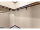 Walk-in closet features rod and shelf storage with grey carpet flooring at 80 David Rd, Hampton, GA 30228