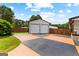 Exterior garage with a multicolored driveway at 80 David Rd, Hampton, GA 30228