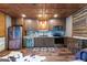 Kitchen area features wood cabinets, stainless steel appliances, granite countertops, and unique tile backsplash at 80 David Rd, Hampton, GA 30228