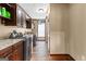 An interior laundry room with modern washer and dryer with cabinets and counter space at 80 David Rd, Hampton, GA 30228