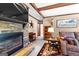 Living room featuring a stone fireplace, comfortable seating, and unique decor at 80 David Rd, Hampton, GA 30228