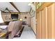 Living room showing a stone fireplace, comfortable couches, and rustic decor at 80 David Rd, Hampton, GA 30228