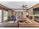 An open living room with wood beams, fireplace, and comfortable seating at 80 David Rd, Hampton, GA 30228