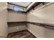Walk-in closet features built-in shelving, offering ample storage space in this home at 80 David Rd, Hampton, GA 30228