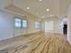 Large basement with tiled floors, recessed lights, and access to the upper level and outside at 6765 Crofton Dr, Alpharetta, GA 30005