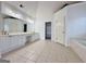 Large bathroom with double sinks, a long vanity, and tile floors at 6765 Crofton Dr, Alpharetta, GA 30005