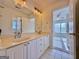 Bathroom featuring double vanity sinks and large mirror at 6765 Crofton Dr, Alpharetta, GA 30005