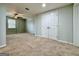 Carpeted bedroom with a ceiling fan, double door closet, and window for ample natural light at 6765 Crofton Dr, Alpharetta, GA 30005