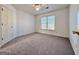 Bright bedroom with a ceiling fan and large window letting in plenty of natural light at 6765 Crofton Dr, Alpharetta, GA 30005