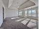 Spacious bedroom with carpet, ceiling fan, and lots of natural light from the windows at 6765 Crofton Dr, Alpharetta, GA 30005