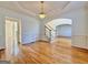 Formal dining room featuring hardwood floors, wainscoting, and a chandelier at 6765 Crofton Dr, Alpharetta, GA 30005
