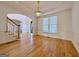 Dining room with hardwood floors, wainscoting, and an elegant chandelier at 6765 Crofton Dr, Alpharetta, GA 30005