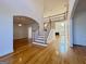 Open-concept foyer with hardwood floors and staircase to the second floor at 6765 Crofton Dr, Alpharetta, GA 30005