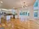 Bright kitchen with white cabinets, island, stainless steel appliances, and open layout at 6765 Crofton Dr, Alpharetta, GA 30005