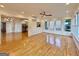 Open-concept living area featuring hardwood floors and multiple windows at 6765 Crofton Dr, Alpharetta, GA 30005
