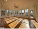 Spacious living room with hardwood floors, many windows and a ceiling fan at 6765 Crofton Dr, Alpharetta, GA 30005