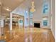 Spacious living room features a fireplace, high ceilings, hardwood floors, and natural light at 6765 Crofton Dr, Alpharetta, GA 30005