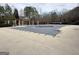 Community pool covered for the off-season, with a pergola and seating area for relaxing by the pool at 6765 Crofton Dr, Alpharetta, GA 30005