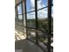 Spacious balcony with floor to ceiling windows offering a stunning view of the city and lush greenery at 3060 Nw Pharr Ct # 517, Atlanta, GA 30305