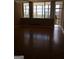 Inviting living room with large windows offering natural light and beautiful parquet floors throughout at 3060 Nw Pharr Ct # 517, Atlanta, GA 30305