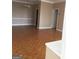 Bright and airy living room showcasing beautiful parquet floors, neutral walls, and classic moldings at 3060 Nw Pharr Ct # 517, Atlanta, GA 30305