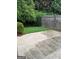 Enclosed backyard featuring a small lawn area and a concrete patio space at 75 Orchard Dr, Covington, GA 30014