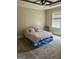 This bedroom features neutral carpeting, a window, and ceiling fan at 75 Orchard Dr, Covington, GA 30014
