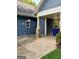 Carport attached to the house with a concrete driveway and partial view of the backyard at 75 Orchard Dr, Covington, GA 30014