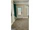 Foyer with a decorative glass door, neutral carpet, and view of stairs at 75 Orchard Dr, Covington, GA 30014