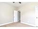 Bedroom with carpet, neutral walls, and door at 5550 Rialto Way, Cumming, GA 30040