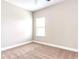 Simple bedroom with neutral walls and carpet at 5550 Rialto Way, Cumming, GA 30040