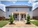 Two-story home with covered patio at 5550 Rialto Way, Cumming, GA 30040