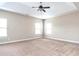 Large main bedroom with high ceilings and carpet at 5550 Rialto Way, Cumming, GA 30040