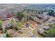 Aerial view of home nestled among neighborhood houses, close to a wooded area, highlighting community and nature access at 192 Pecan Dr, Canton, GA 30114