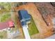 An aerial view of a modern two-story home with a gray exterior, a long driveway and small yard at 192 Pecan Dr, Canton, GA 30114