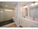 Bathroom featuring a tiled shower, a soaking tub and double sink vanity at 192 Pecan Dr, Canton, GA 30114