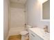 Bathroom featuring an integrated tub and shower with a modern vanity and faucet at 192 Pecan Dr, Canton, GA 30114