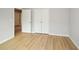 This bedroom offers a double-door closet and views of other rooms in the house at 192 Pecan Dr, Canton, GA 30114