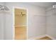 Walk-in closet leading to bedroom, featuring wire shelving for easy organization and ample storage at 192 Pecan Dr, Canton, GA 30114