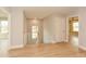 Bright hallway with wood floors and staircase leading to the upper level at 192 Pecan Dr, Canton, GA 30114