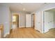 Hallway featuring natural light, wood flooring, and access to multiple rooms at 192 Pecan Dr, Canton, GA 30114