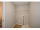 Efficient laundry room with hookups and a shelf, offering practicality and convenience at 192 Pecan Dr, Canton, GA 30114