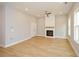 Spacious living room featuring a modern fireplace, recessed lighting, and ample natural light at 192 Pecan Dr, Canton, GA 30114