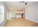 Open living space with natural light flowing into the kitchen with island and stainless appliances at 192 Pecan Dr, Canton, GA 30114