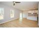 Bright living space offering natural light with view of modern kitchen with a breakfast bar at 192 Pecan Dr, Canton, GA 30114
