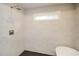 Elegant walk-in shower with marble-patterned tile and a rain shower head, complemented by a window at 192 Pecan Dr, Canton, GA 30114